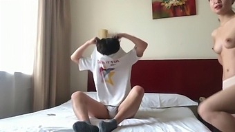 The Chinese Couple Were Staying In A Hotel Room.