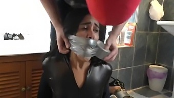 Two Girls In Catsuit Duct Taped And Gagged