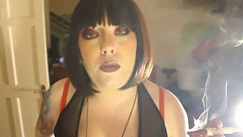 Domme Tina Smokes A Filterless Cigarette In A Holder